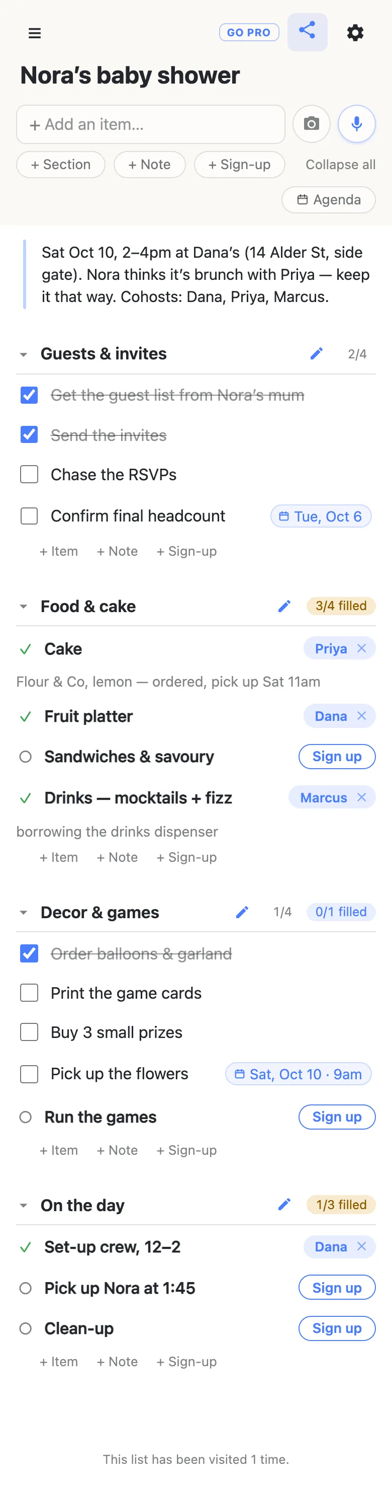 A phone showing a list titled “Nora’s baby shower”. A note at the top gives Saturday October 10, 2 to 4pm at Dana’s, and says Nora thinks it is brunch with Priya. Four sections follow. Guests & invites reads 2/4, with two jobs ticked and “Confirm final headcount” carrying a date chip for Tuesday October 6. Food & cake reads an amber 3/4 filled: Cake is claimed by Priya with the note “Flour & Co, lemon — ordered, pick up Sat 11am”, Fruit platter by Dana, Sandwiches & savoury shows a Sign up button, and Drinks by Marcus with “borrowing the drinks dispenser”. Decor & games reads 1/4 and 0/1 filled, with “Pick up the flowers” dated Saturday October 10 at 9am and “Run the games” open. On the day reads 1/3 filled, with set-up claimed by Dana and two open slots.