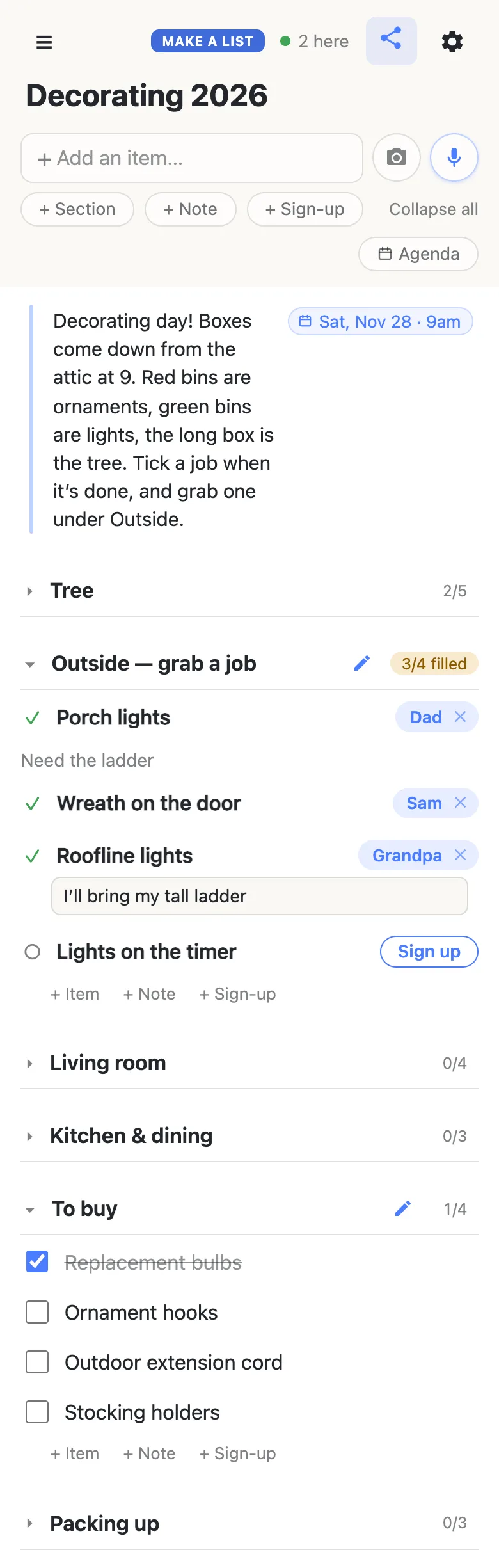 Grandpa’s phone on the same Decorating 2026 list, with “2 here” showing at the top. The Tree section is folded at 2/5. Outside — grab a job now reads 3/4 filled: Dad has the Porch lights (Need the ladder), Sam has the Wreath on the door, and Grandpa has just signed up for the Roofline lights, with a note box under it reading I’ll bring my tall ladder. Lights on the timer still shows a Sign up button. Living room (0/4) and Kitchen & dining (0/3) are folded. The To buy section is open at 1/4: Replacement bulbs is ticked and struck through; Ornament hooks, Outdoor extension cord and Stocking holders are open. Packing up is folded at 0/3.