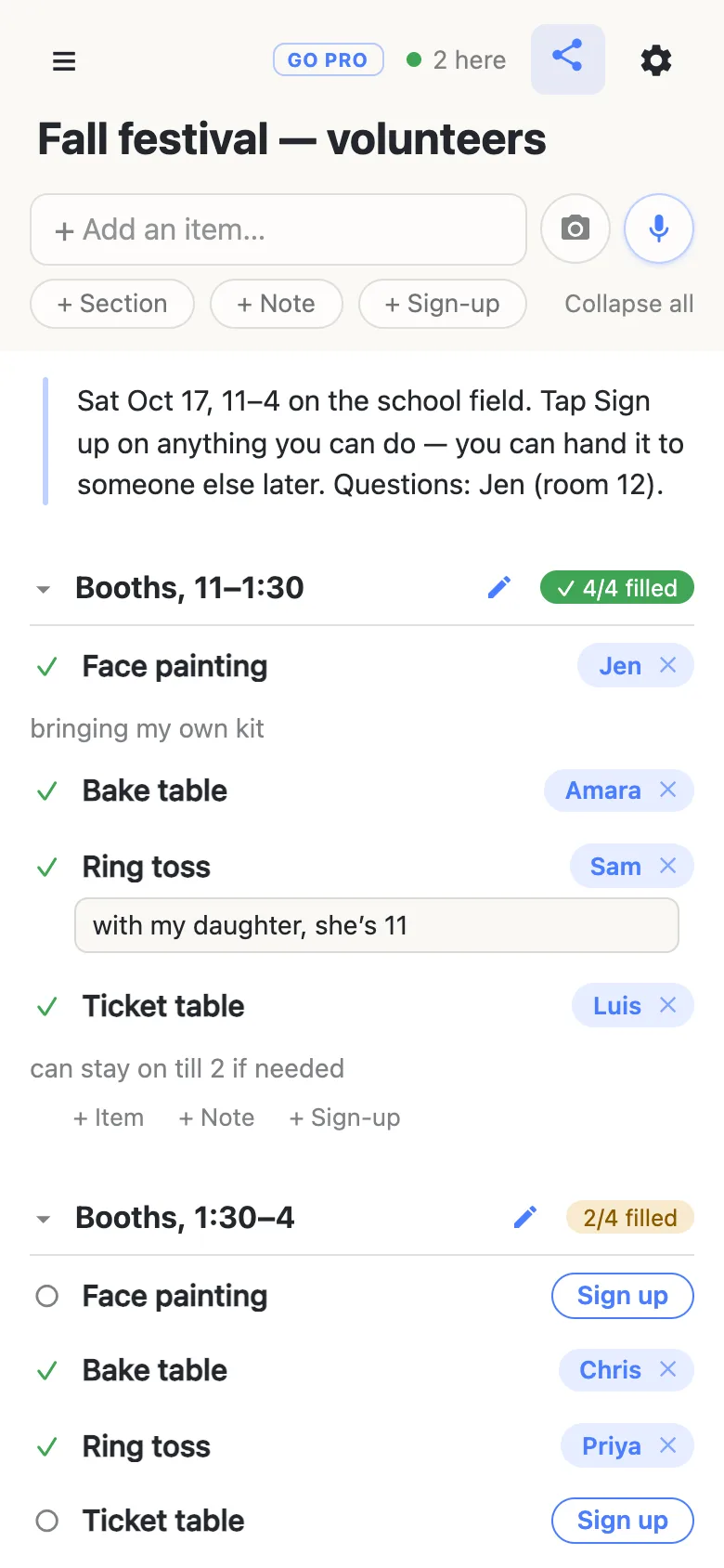 A second phone, moments after tapping Sign up on the ring toss row. The row now carries a name chip reading “Sam” with a small ×, and a text field beneath it holds the half-typed note “with my daughter, she’s 11”. Above it, face painting and bake table are already claimed by Jen and Amara; the section counter reads 4/4 filled.
