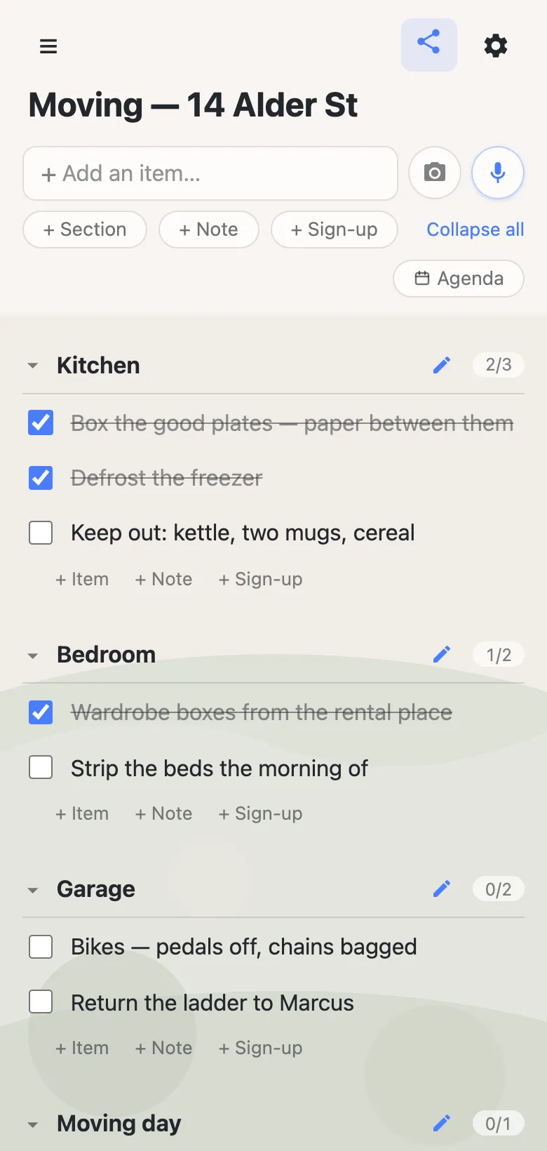 A moving checklist on a phone titled “Moving — 14 Alder St”, with sections for Kitchen, Bedroom, Garage and Moving day. Each section header shows a counter such as 2/3, and finished rows like “Defrost the freezer” are ticked and struck through.