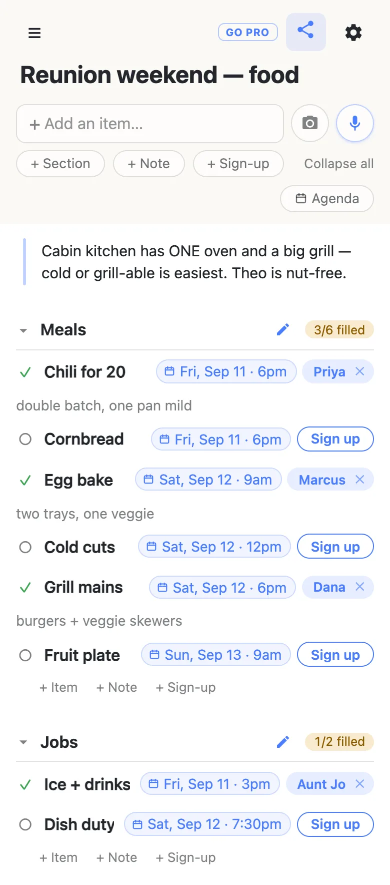 A potluck sheet on a phone titled “Reunion weekend — food”: a note about the kitchen, a Meals section reading 3/6 filled where every row carries a date chip — Chili for 20 on Fri, Sep 11 · 6pm claimed by Priya, Cornbread still open, Egg bake on Sat, Sep 12 · 9am claimed by Marcus — and a Jobs section below reading 1/2 filled.