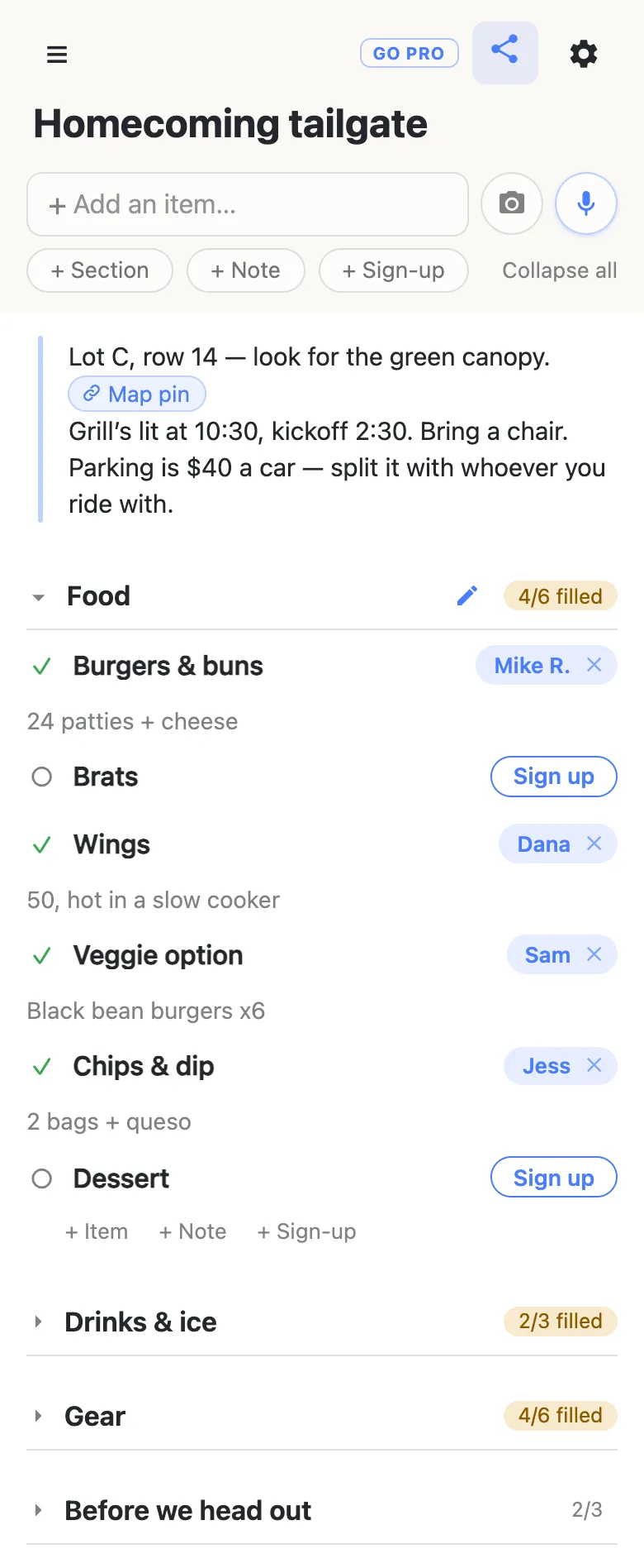 A phone showing a list titled “Homecoming tailgate”. A note at the top reads: Lot C, row 14 — look for the green canopy, with a Map pin link, then Grill’s lit at 10:30, kickoff 2:30, bring a chair, and parking is $40 a car split with whoever you ride with. The Food section reads 4/6 filled: Mike R. has Burgers & buns (“24 patties + cheese”), Dana has Wings (“50, hot in a slow cooker”), Sam has the Veggie option (“Black bean burgers x6”) and Jess has Chips & dip (“2 bags + queso”). Brats and Dessert still show Sign up buttons. Below, Drinks & ice reads 2/3 filled, Gear 4/6 filled and Before we head out 2/3.