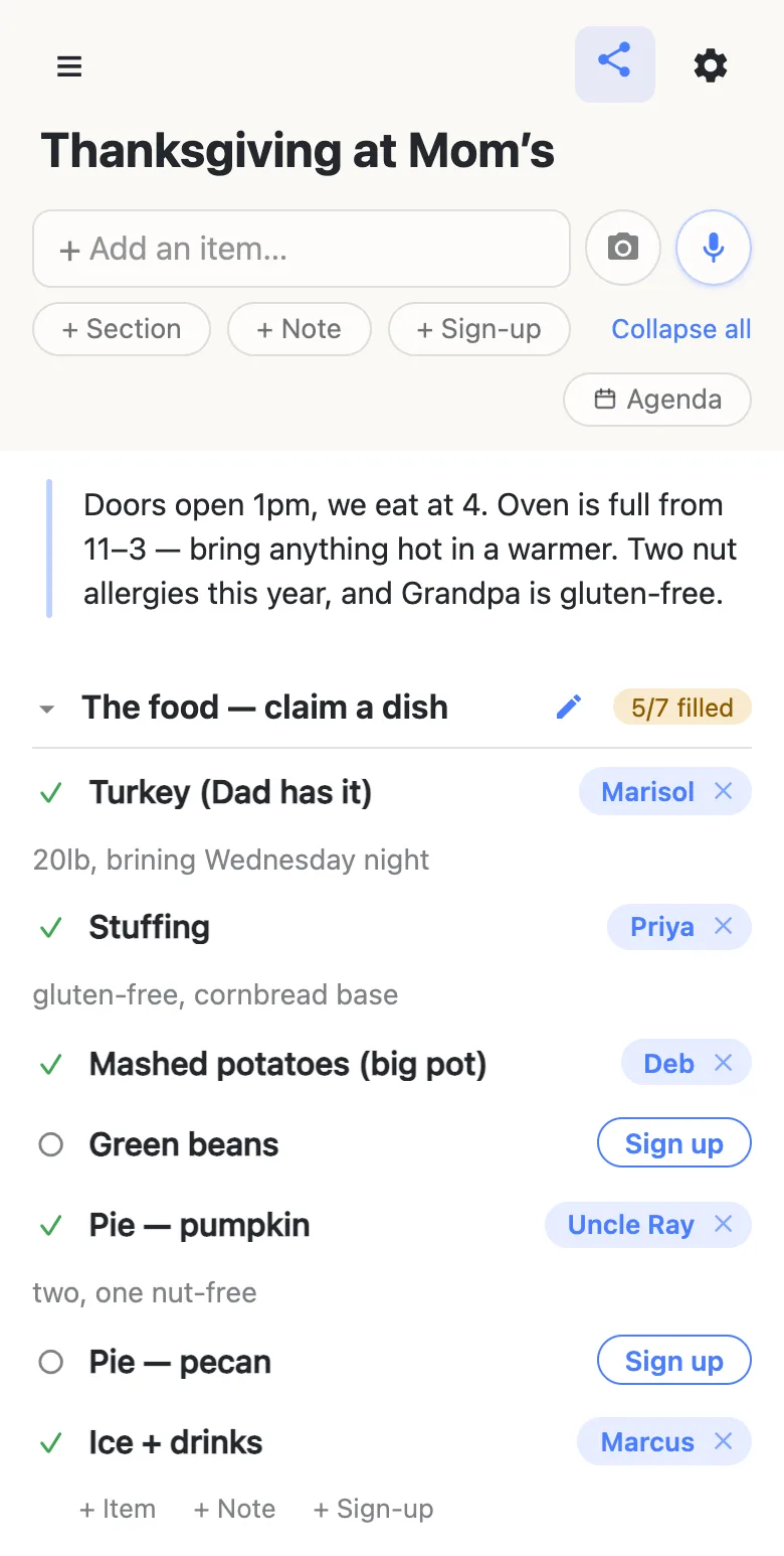 A phone showing a list titled “Thanksgiving at Mom’s”. A note at the top reads “Doors open 1pm, we eat at 4. Oven is full from 11–3 — bring anything hot in a warmer. Two nut allergies this year, and Grandpa is gluten-free.” Below it a section headed “The food — claim a dish” carries an amber 5/7 filled counter; claimed rows show names like Marisol, Priya, Deb, Uncle Ray and Marcus with notes such as “20lb, brining Wednesday night” and “gluten-free, cornbread base”, while Green beans and Pie — pecan still show a blue Sign up button.